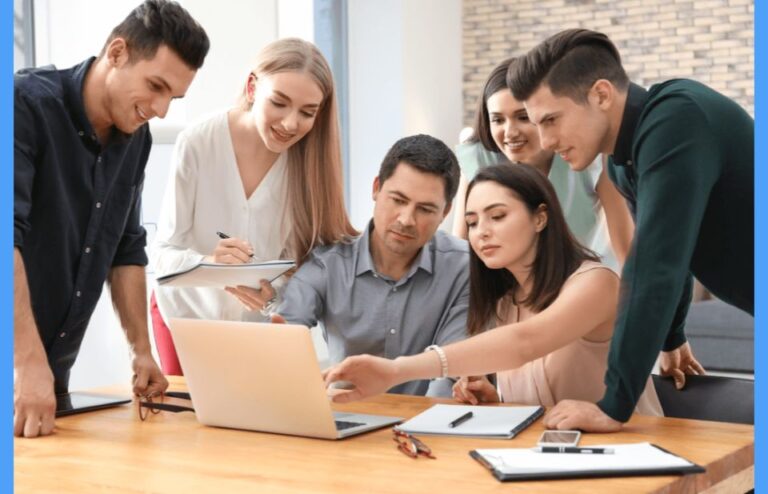 Staff meeting in office around table
